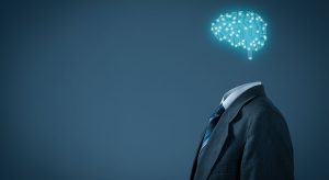 Imagem de cérebro como se fosse um sistema de computador em cima de paletó sem cabeça para ilustrar a inovação na advocacia