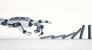 mão robótica derrubando dominó para ilustrar os impactos da tecnologia na área jurídica